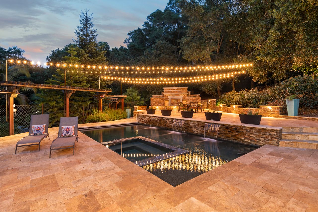 A beautifully staged outdoor pool at dusk